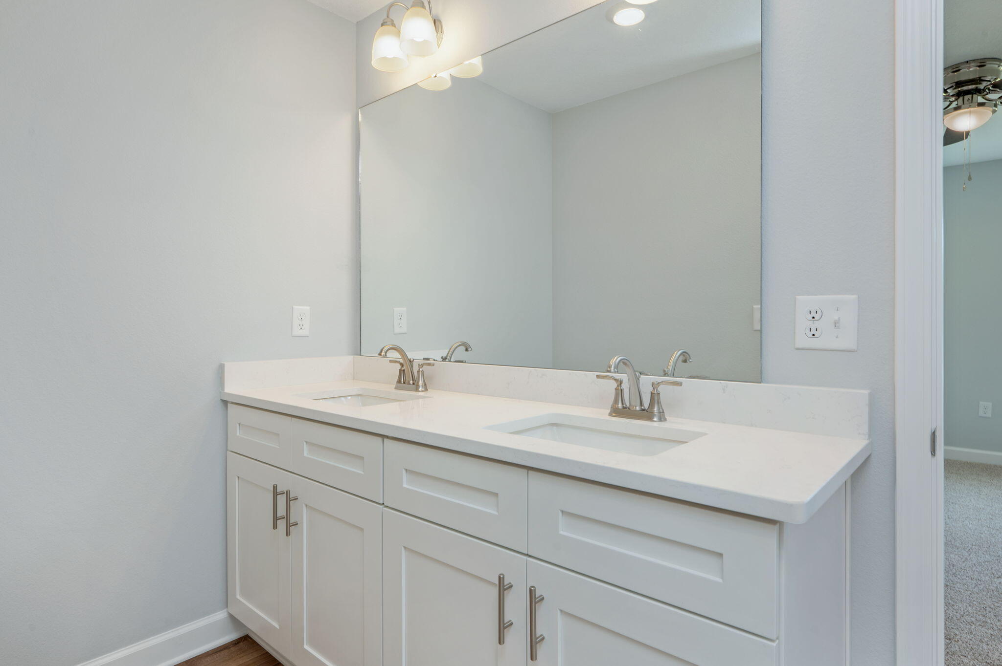 3863 Poverty Creek Road Crestview, FL 32539 - Photo 17 of 31 a bathroom with a sink and a mirror