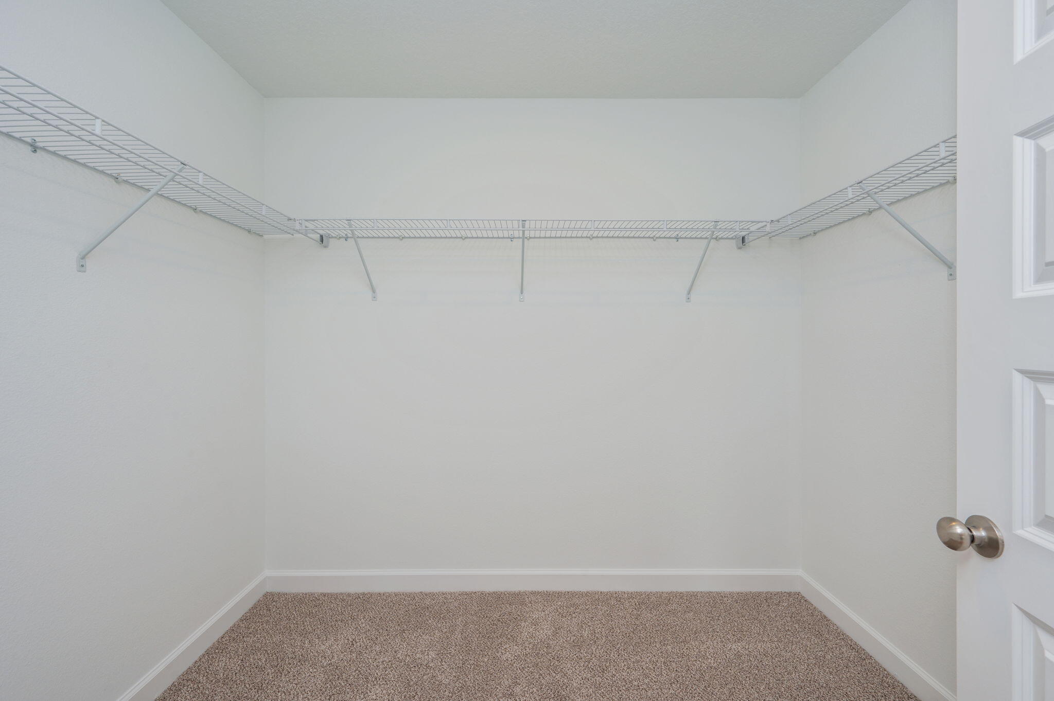 3863 Poverty Creek Road Crestview, FL 32539 - Photo 21 of 31 a view of a room with racks on the wall