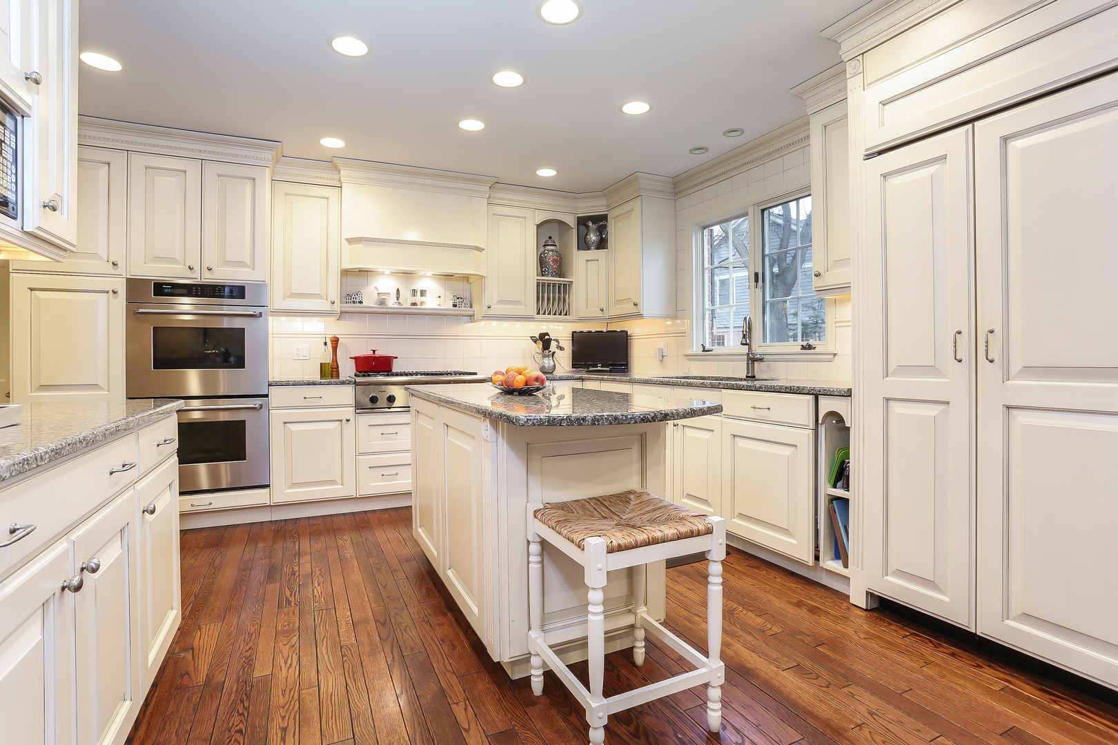 1350 Inverlieth Road Lake Forest, IL 60045 - Photo 12 of 43 a kitchen with white cabinets and white appliances