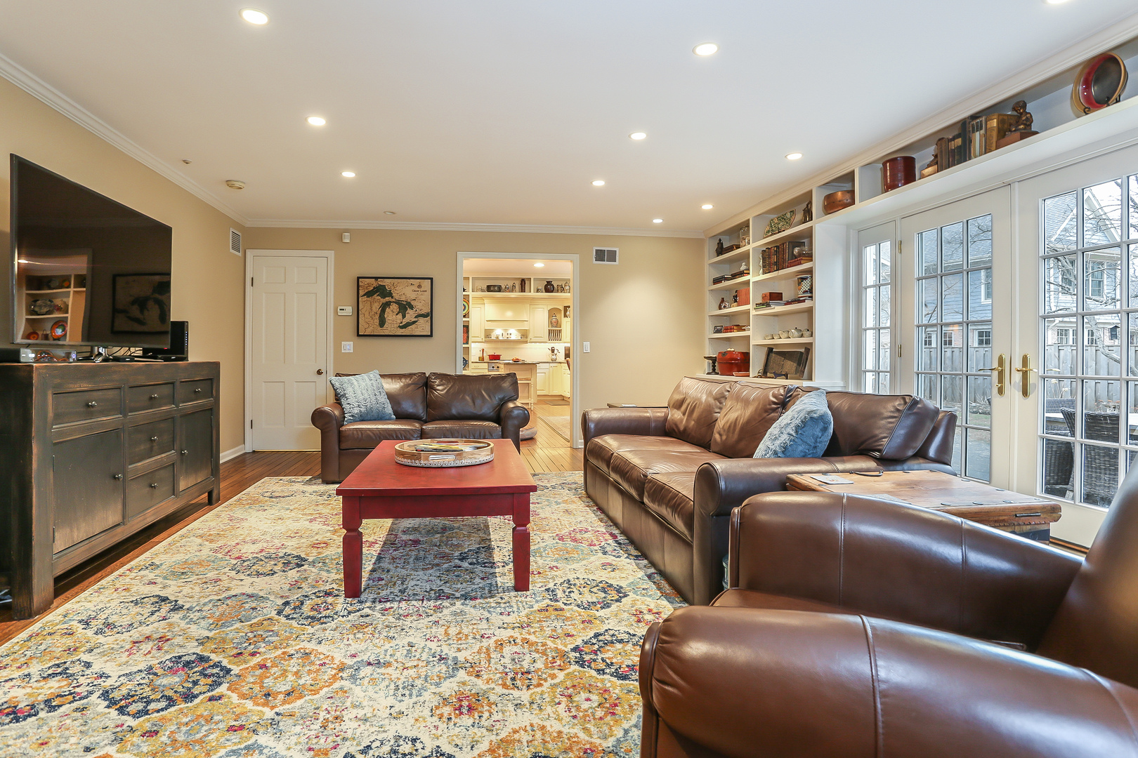 1350 Inverlieth Road Lake Forest, IL 60045 - Photo 13 of 43 a living room with a couch and a flat screen tv