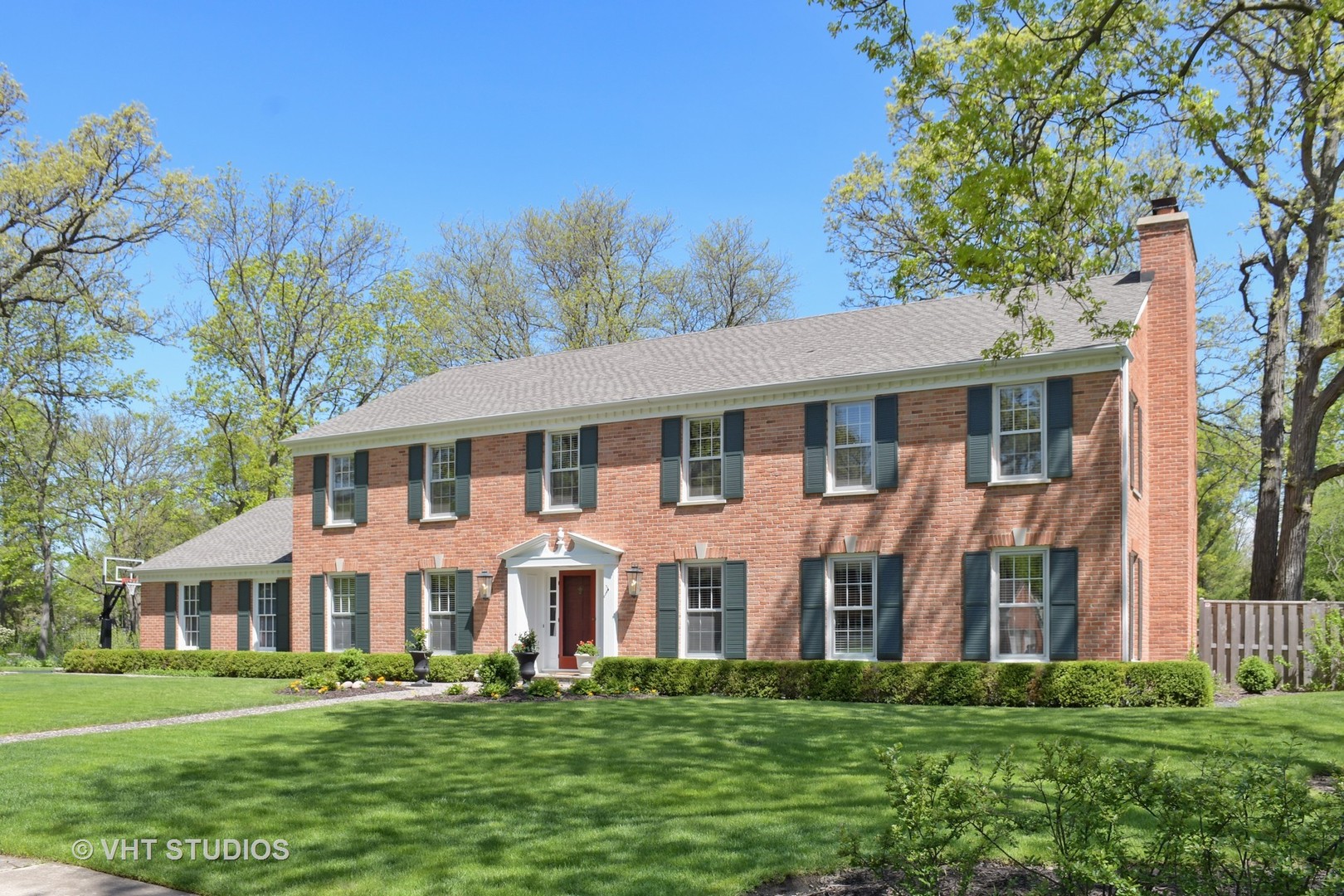 1350 Inverlieth Road Lake Forest, IL 60045 - Photo 3 of 43 a front view of a house with a garden