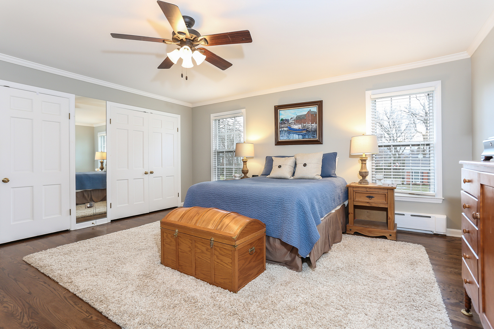 1350 Inverlieth Road Lake Forest, IL 60045 - Photo 23 of 43 a spacious bedroom with a bed and a chandelier