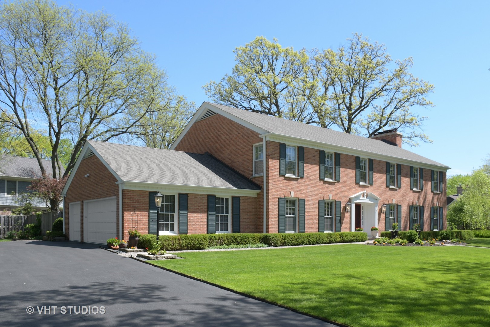 1350 Inverlieth Road Lake Forest, IL 60045 - Photo 4 of 43 a front view of a house with a garden