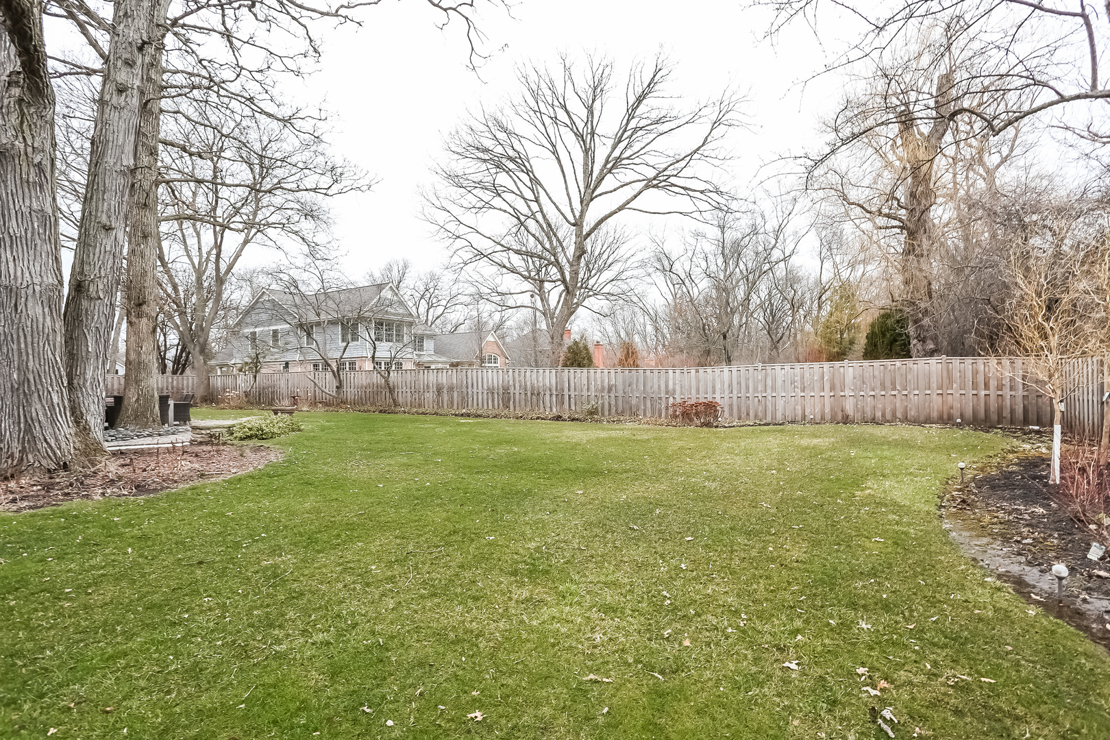 1350 Inverlieth Road Lake Forest, IL 60045 - Photo 40 of 43 a view of yard with tree and wooden fence