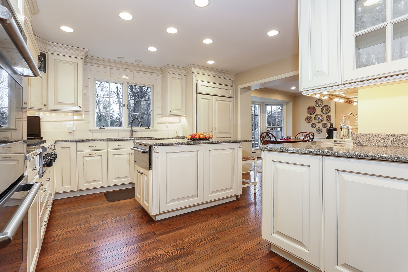 1350 Inverlieth Road Lake Forest, IL 60045 - Photo 9 of 43 a kitchen with white cabinets sink and stainless steel appliances