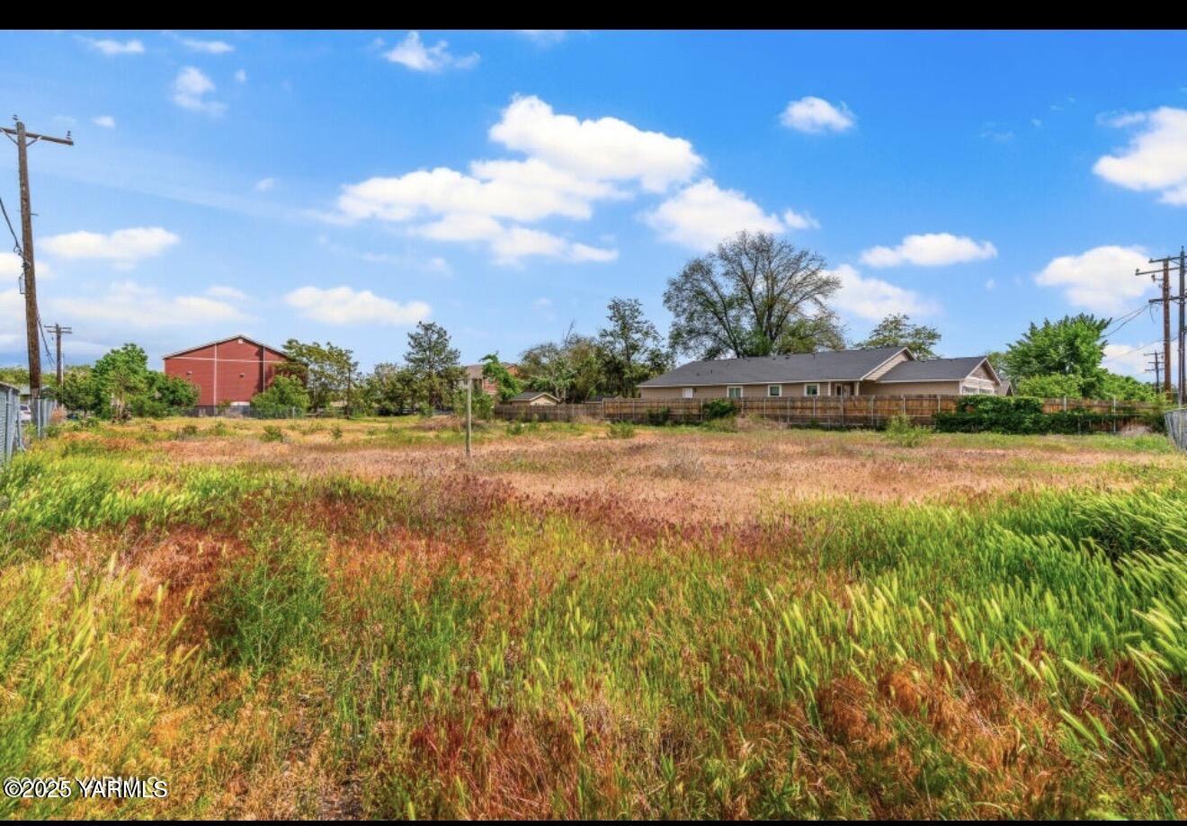 1506 East Beech Street Yakima, WA 98901 - Photo 2 of 8 a view of a lake with a big yard