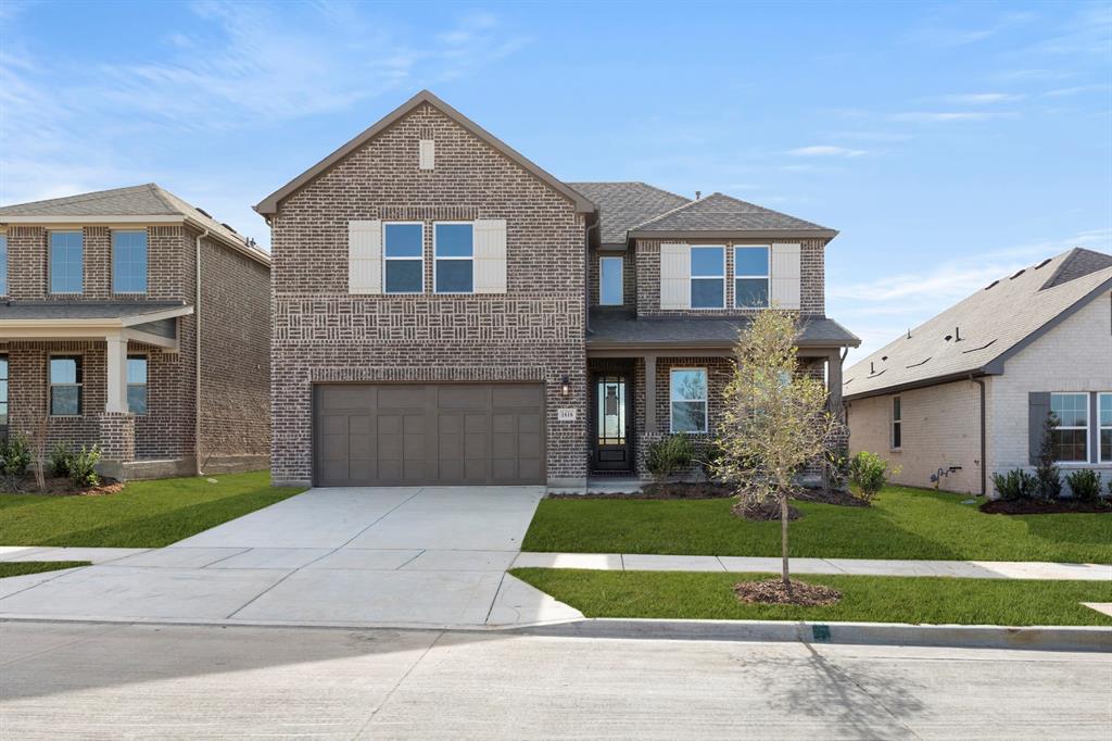 1616 Abbott Crk Road Celina, TX 75009 - Photo 1 of 1 a front view of a house with a yard and garage