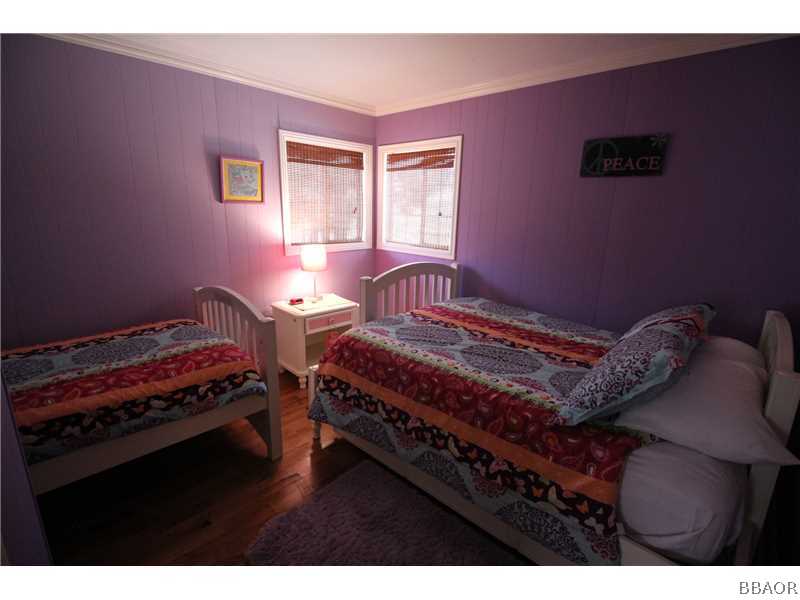 535 Highland Road Big Bear Lake, CA 92315 - Photo 11 of 15 a bedroom with two beds and a window