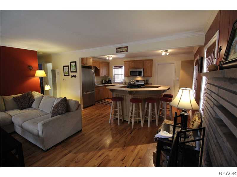 535 Highland Road Big Bear Lake, CA 92315 - Photo 5 of 15 a living room with furniture and a wooden floor