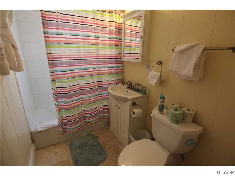 535 Highland Road Big Bear Lake, CA 92315 - Photo 10 of 15 a bathroom with a sink toilet and shower