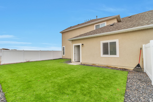 5417 West 3850 South Hooper, UT 84315 - Photo 22 of 22 Professionally designed and fully fenced side yard.