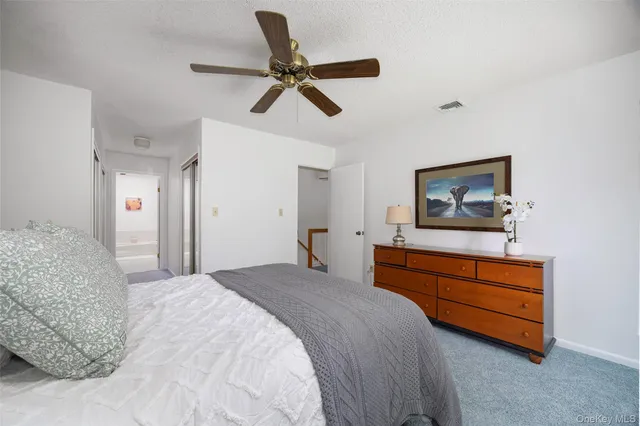 a bathroom with a tub sink and toilet