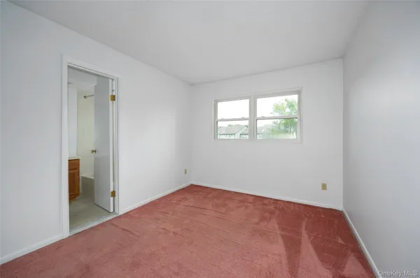 a living room with furniture and stairs