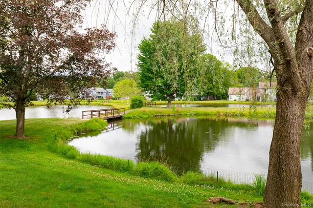 a view of house with outdoor space and swimming pool