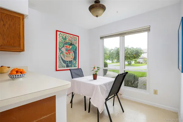 a kitchen with a refrigerator and a sink