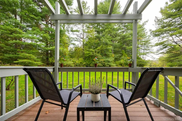 a dining room with furniture window and wooden floor