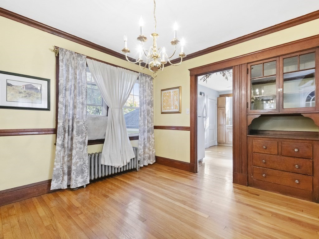 149 Trapelo Road Waltham, MA 02452 - Photo 15 of 36 a view of livingroom with hardwood floor and cabinet