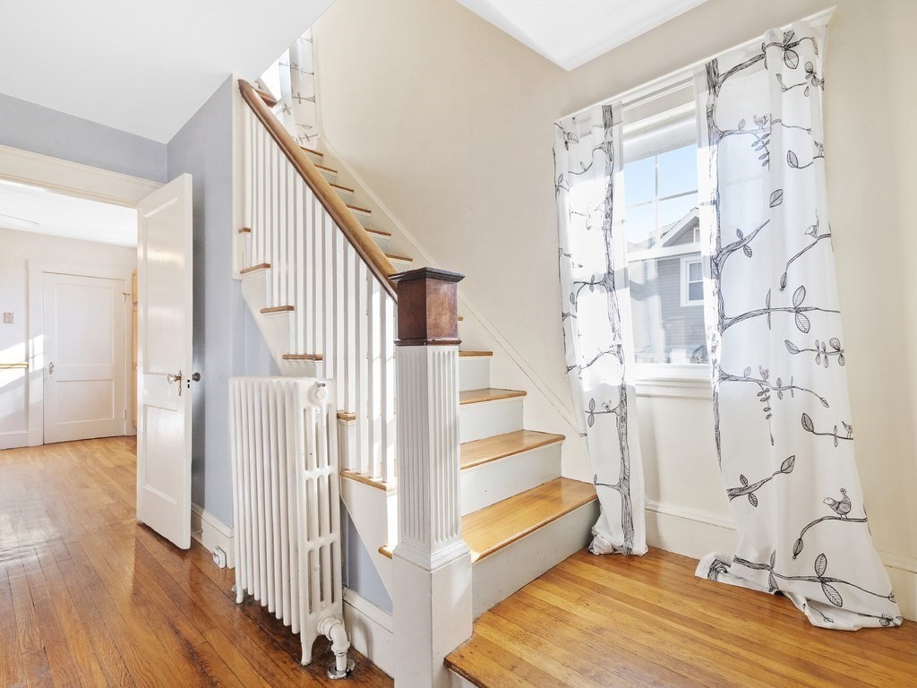 149 Trapelo Road Waltham, MA 02452 - Photo 17 of 36 a view of entryway with wooden floor and stairs