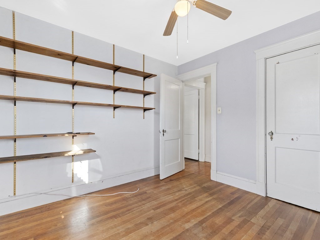 149 Trapelo Road Waltham, MA 02452 - Photo 21 of 36 a view of empty room with wooden floor and fan