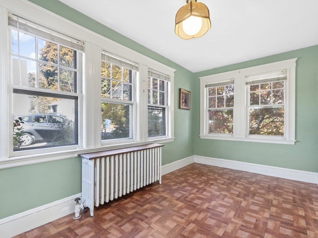 149 Trapelo Road Waltham, MA 02452 - Photo 29 of 36 a view of empty room with window fan and front door