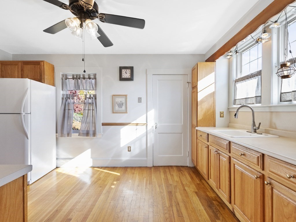 149 Trapelo Road Waltham, MA 02452 - Photo 3 of 36 a kitchen with stainless steel appliances a refrigerator and a window