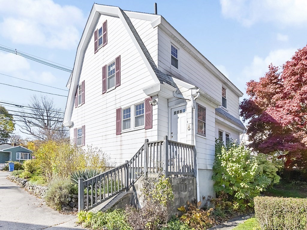 149 Trapelo Road Waltham, MA 02452 - Photo 32 of 36 a view of a house with a small yard and wooden fence
