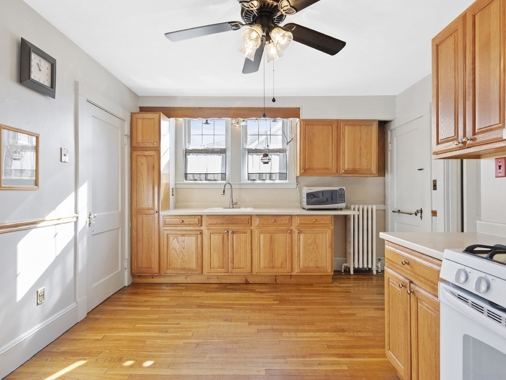 149 Trapelo Road Waltham, MA 02452 - Photo 4 of 36 a kitchen with stainless steel appliances granite countertop a stove a sink and a refrigerator