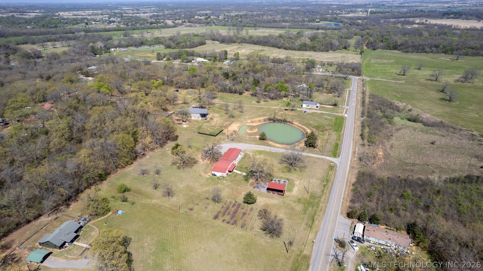 3565 Sawmill Road Caddo, OK 74729 - Photo 29 of 32 Expansive land offering multiple structures, a private pond, and mature tree coverage