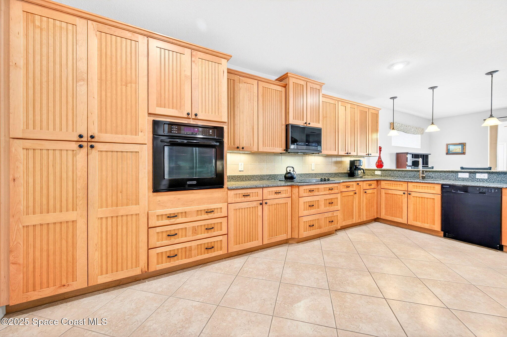 3407 Bancroft Drive Melbourne, FL 32940 - Photo 12 of 74 a kitchen with stainless steel appliances granite countertop a stove a sink and white cabinets