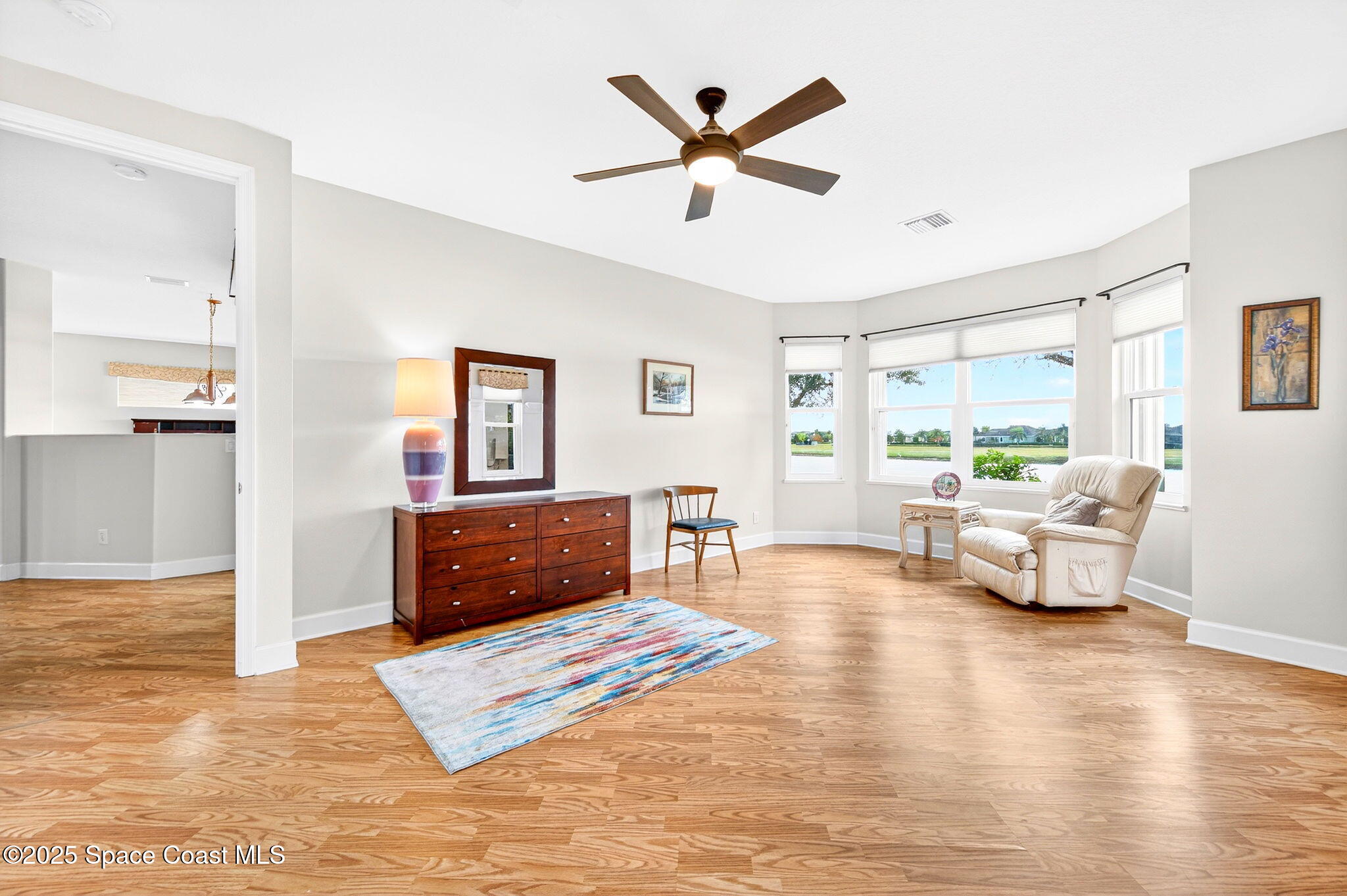 3407 Bancroft Drive Melbourne, FL 32940 - Photo 20 of 74 a living room with furniture and a large window