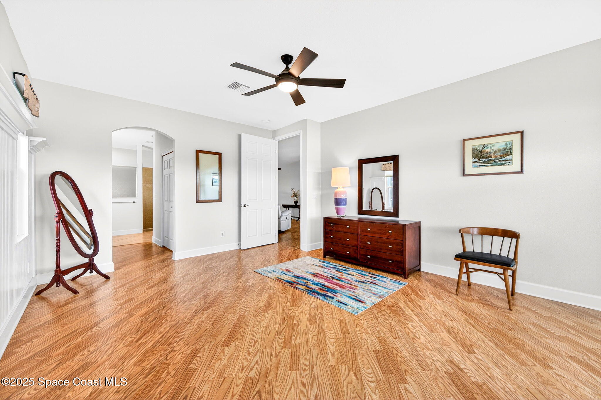 3407 Bancroft Drive Melbourne, FL 32940 - Photo 21 of 74 a living room with couch piano and a wooden floor