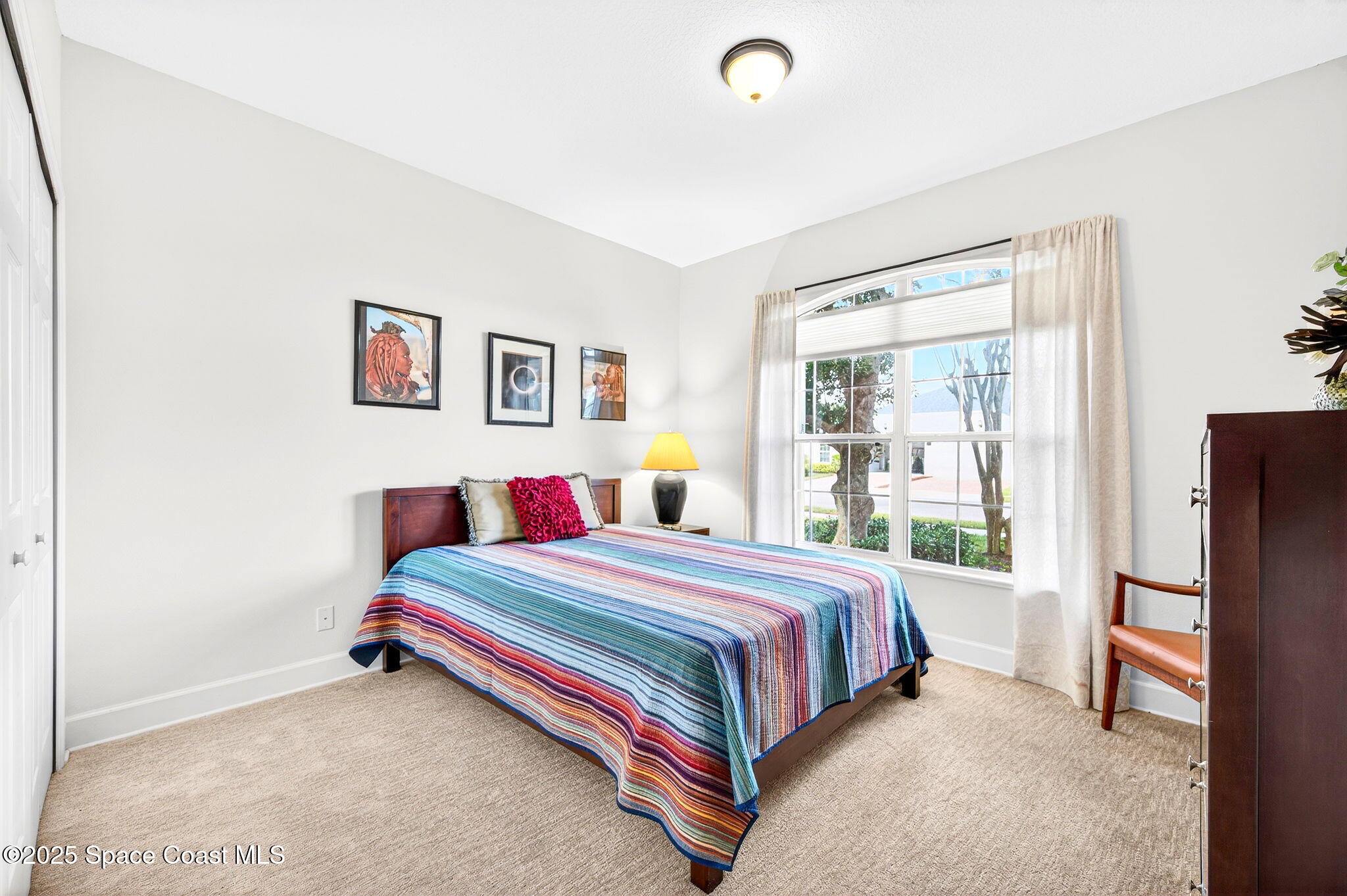 3407 Bancroft Drive Melbourne, FL 32940 - Photo 29 of 74 a bedroom with a bed and a window