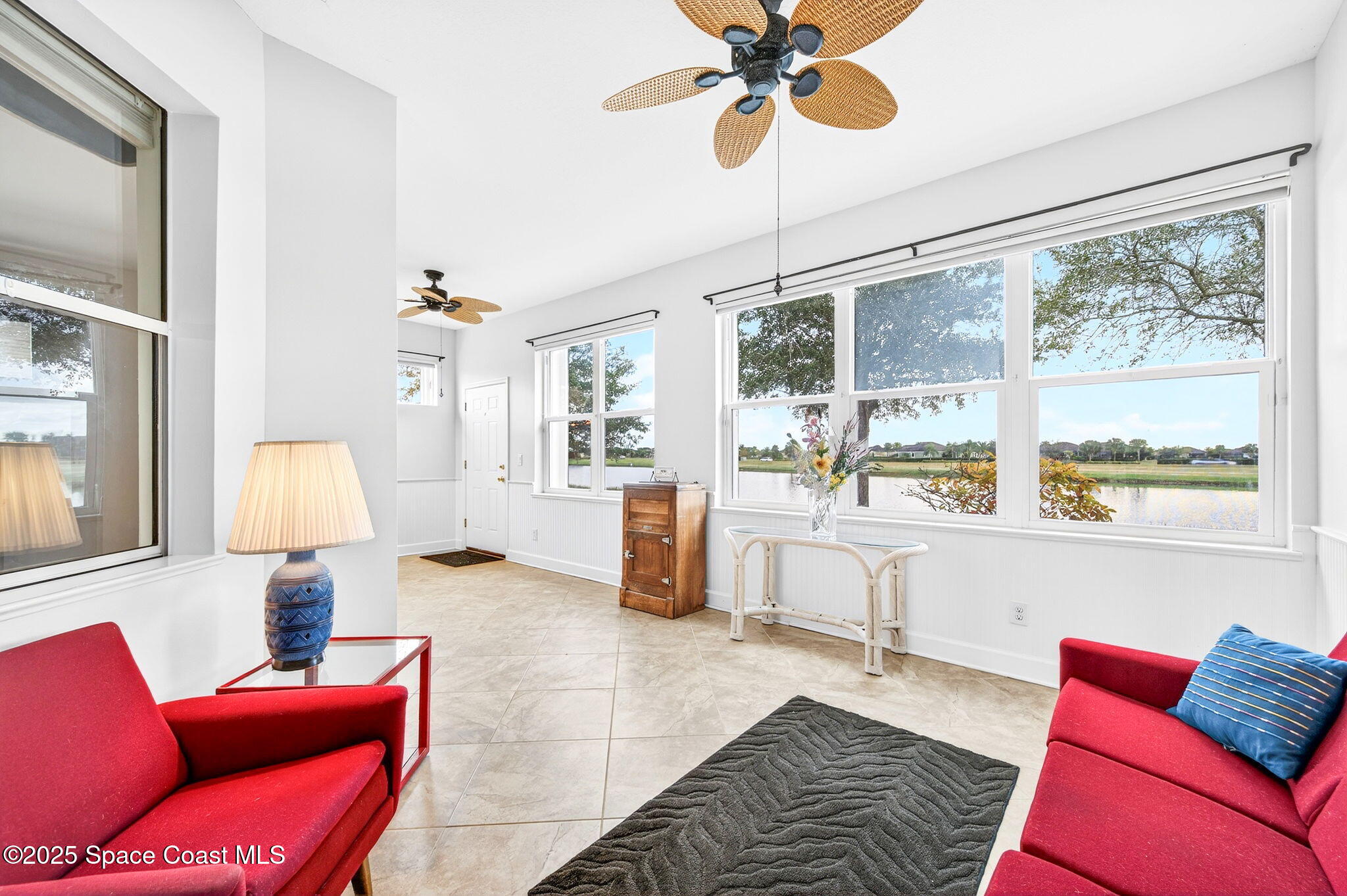 3407 Bancroft Drive Melbourne, FL 32940 - Photo 34 of 74 a living room with furniture and a large window