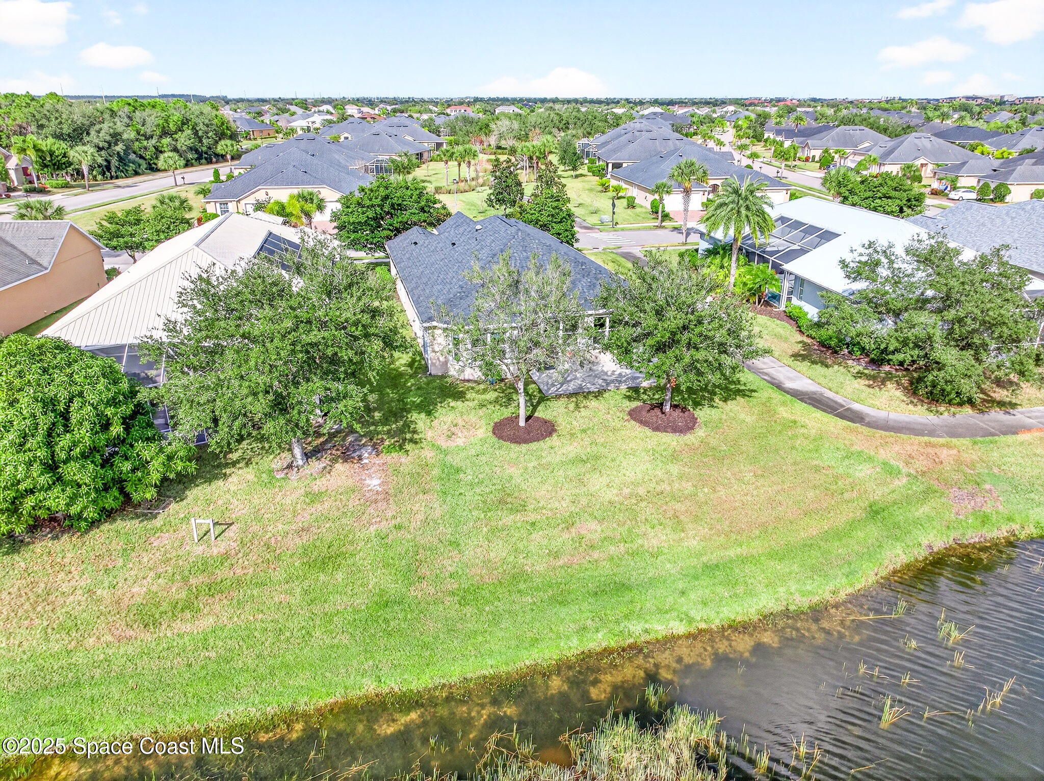 3407 Bancroft Drive Melbourne, FL 32940 - Photo 66 of 74 an aerial view of residential houses with outdoor space and street view