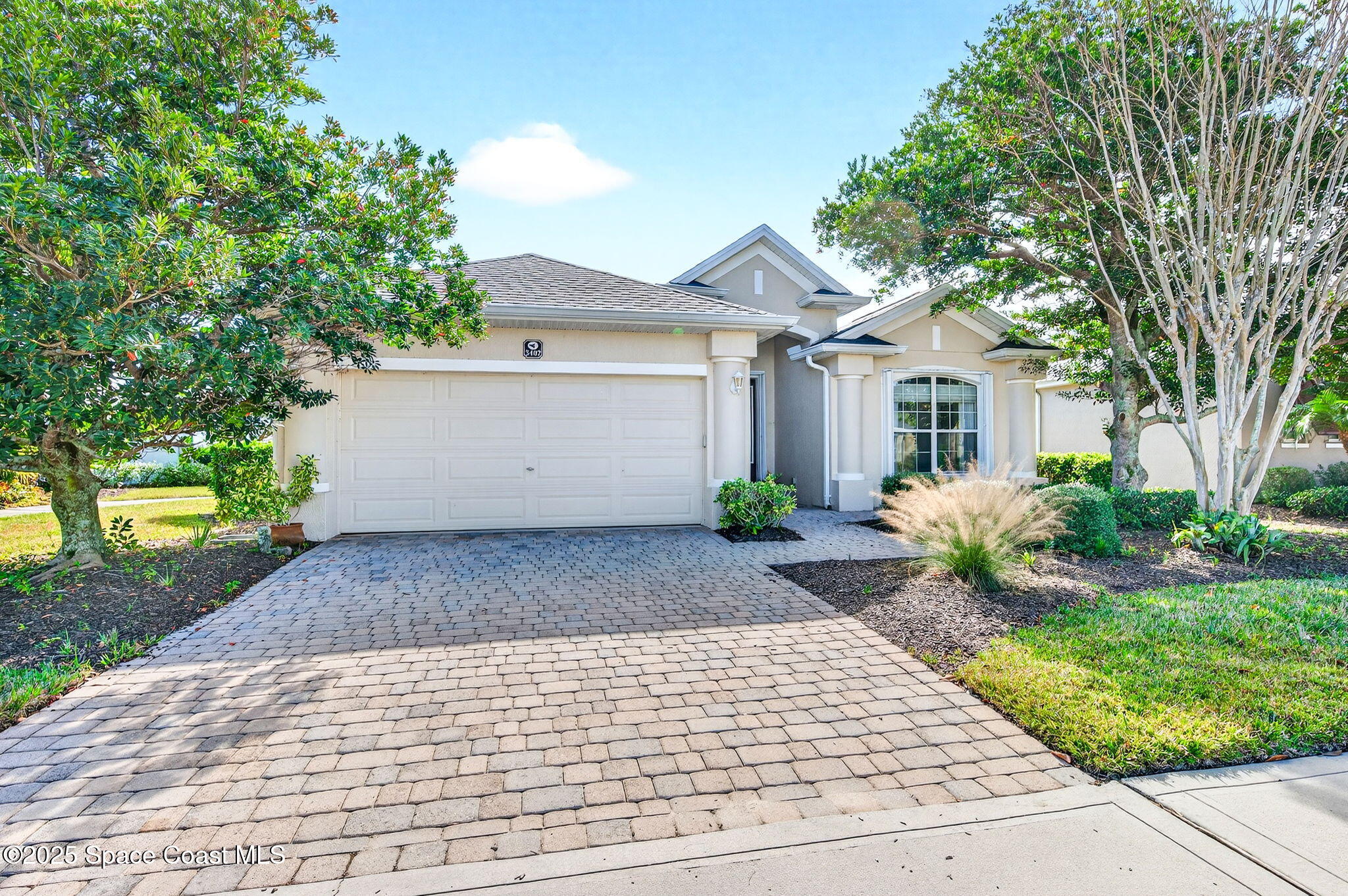 3407 Bancroft Drive Melbourne, FL 32940 - Photo 74 of 74 a view of a white house with a yard and plants