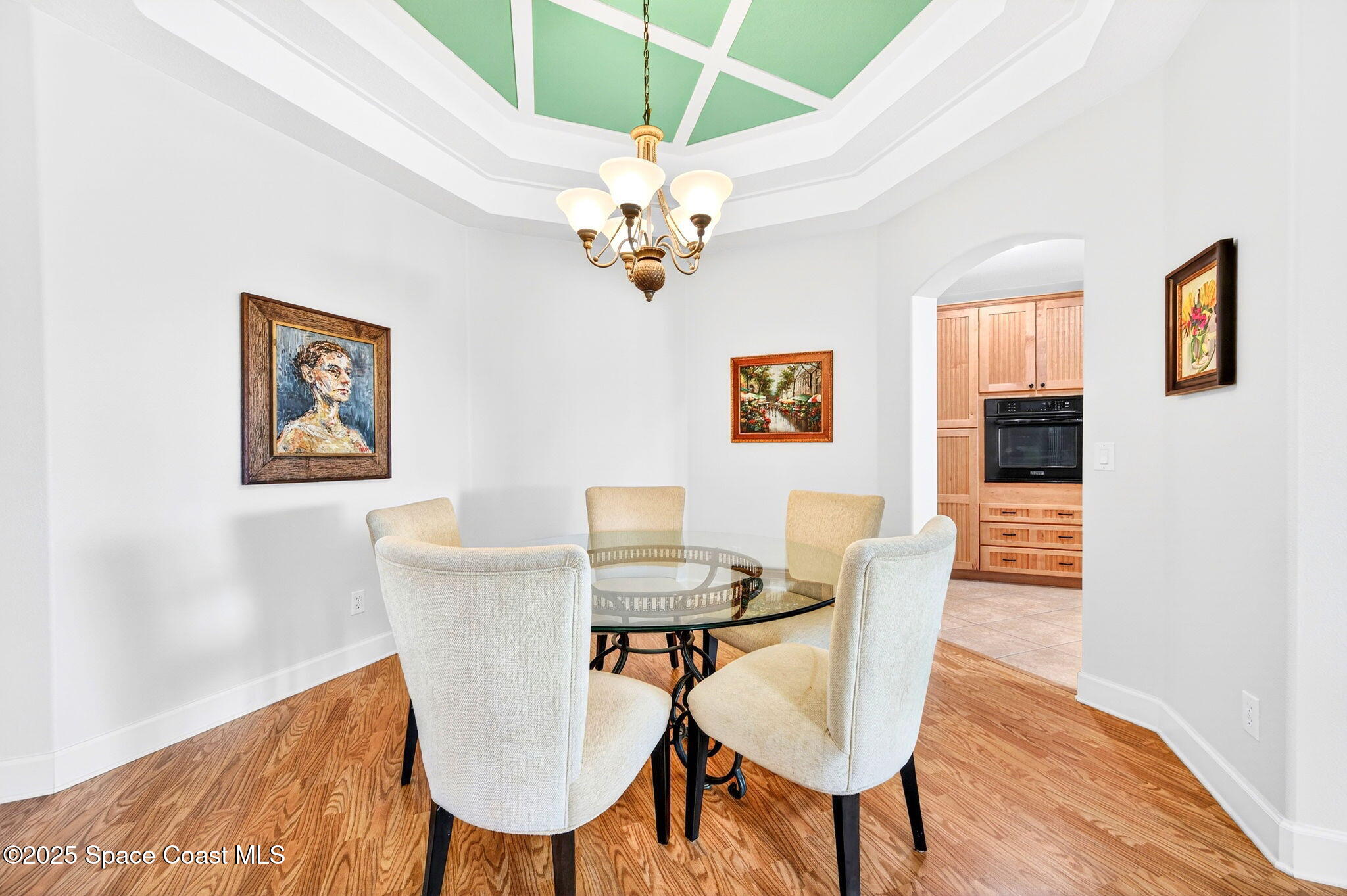 3407 Bancroft Drive Melbourne, FL 32940 - Photo 10 of 74 a view of a dining room with furniture and wooden floor