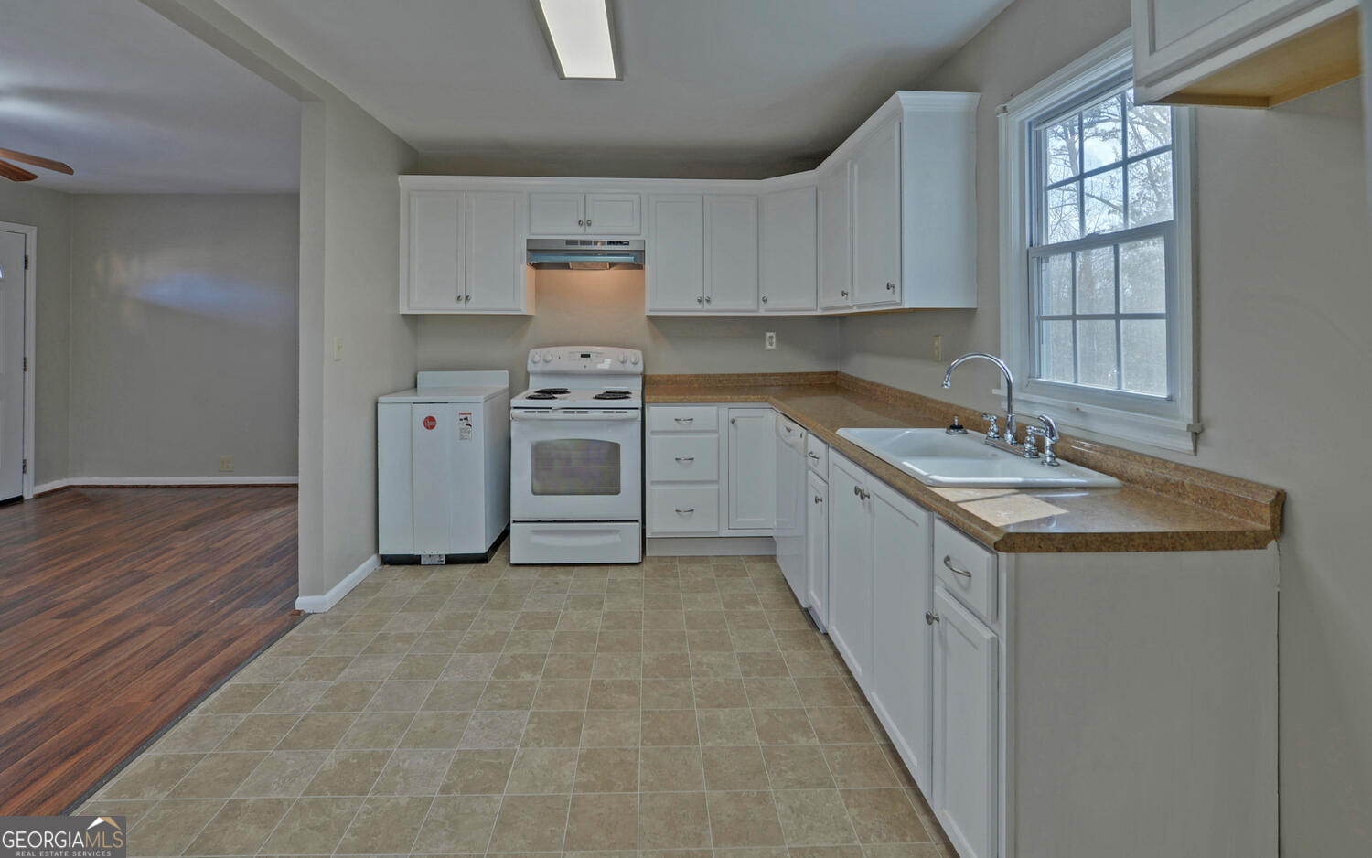 297 East Leatherwood Road Toccoa, GA 30577 - Photo 12 of 37 a kitchen with stainless steel appliances granite countertop a sink stove and cabinets
