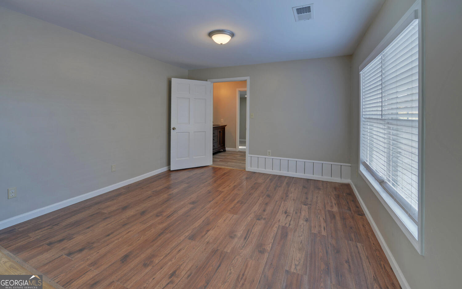 297 East Leatherwood Road Toccoa, GA 30577 - Photo 16 of 37 wooden floor in an empty room with a window
