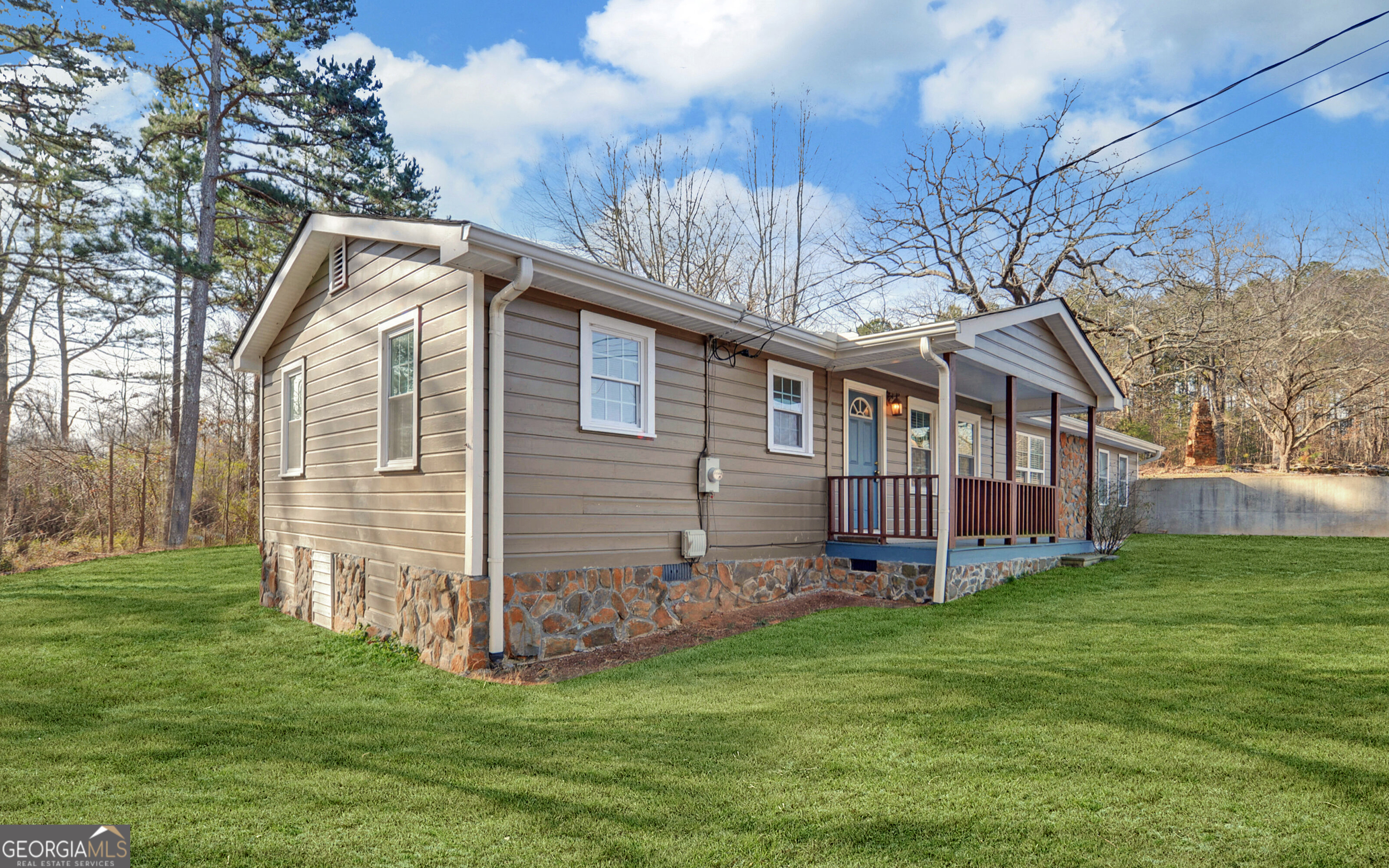 297 East Leatherwood Road Toccoa, GA 30577 - Photo 2 of 37 a view of a house with a yard