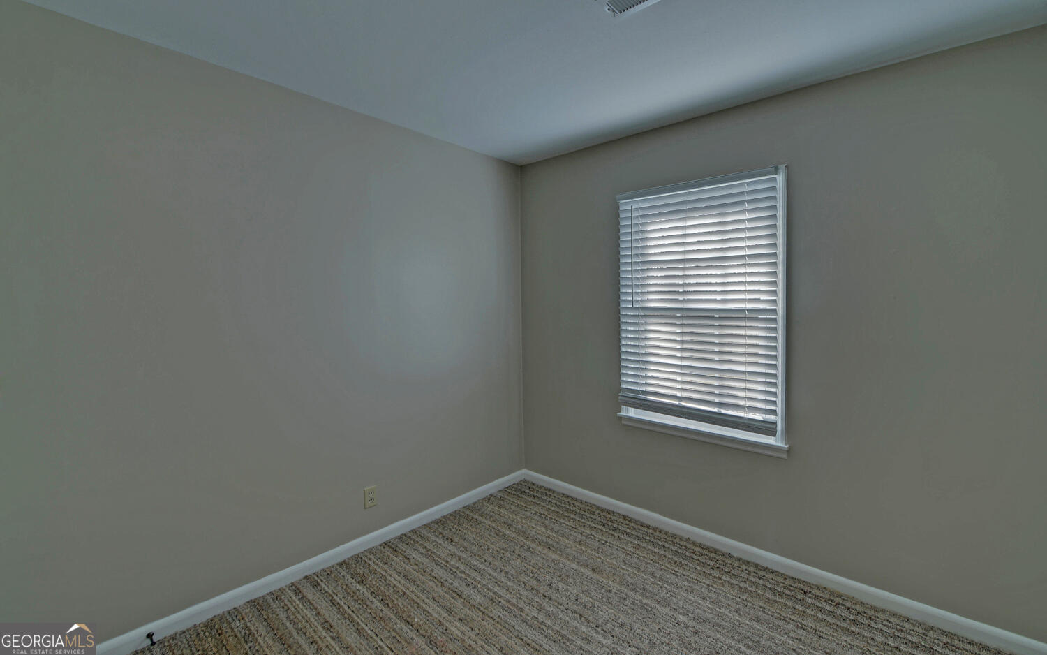 297 East Leatherwood Road Toccoa, GA 30577 - Photo 26 of 37 a view of an empty room with wooden floor and a window