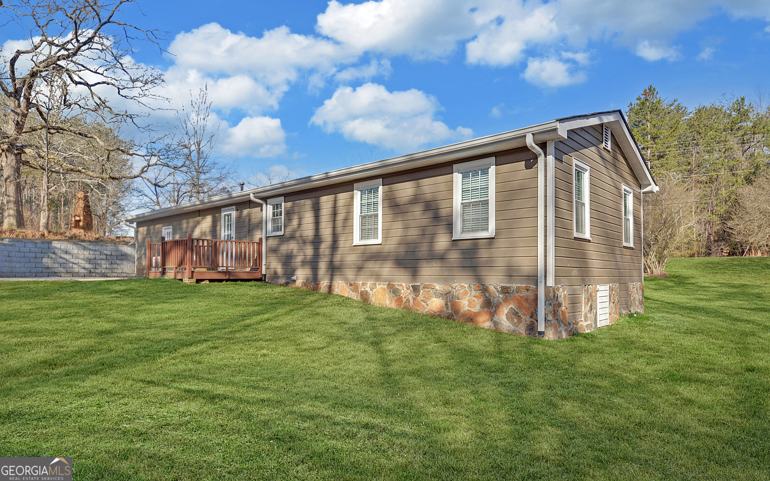 297 East Leatherwood Road Toccoa, GA 30577 - Photo 3 of 37 a view of a house with backyard and garden