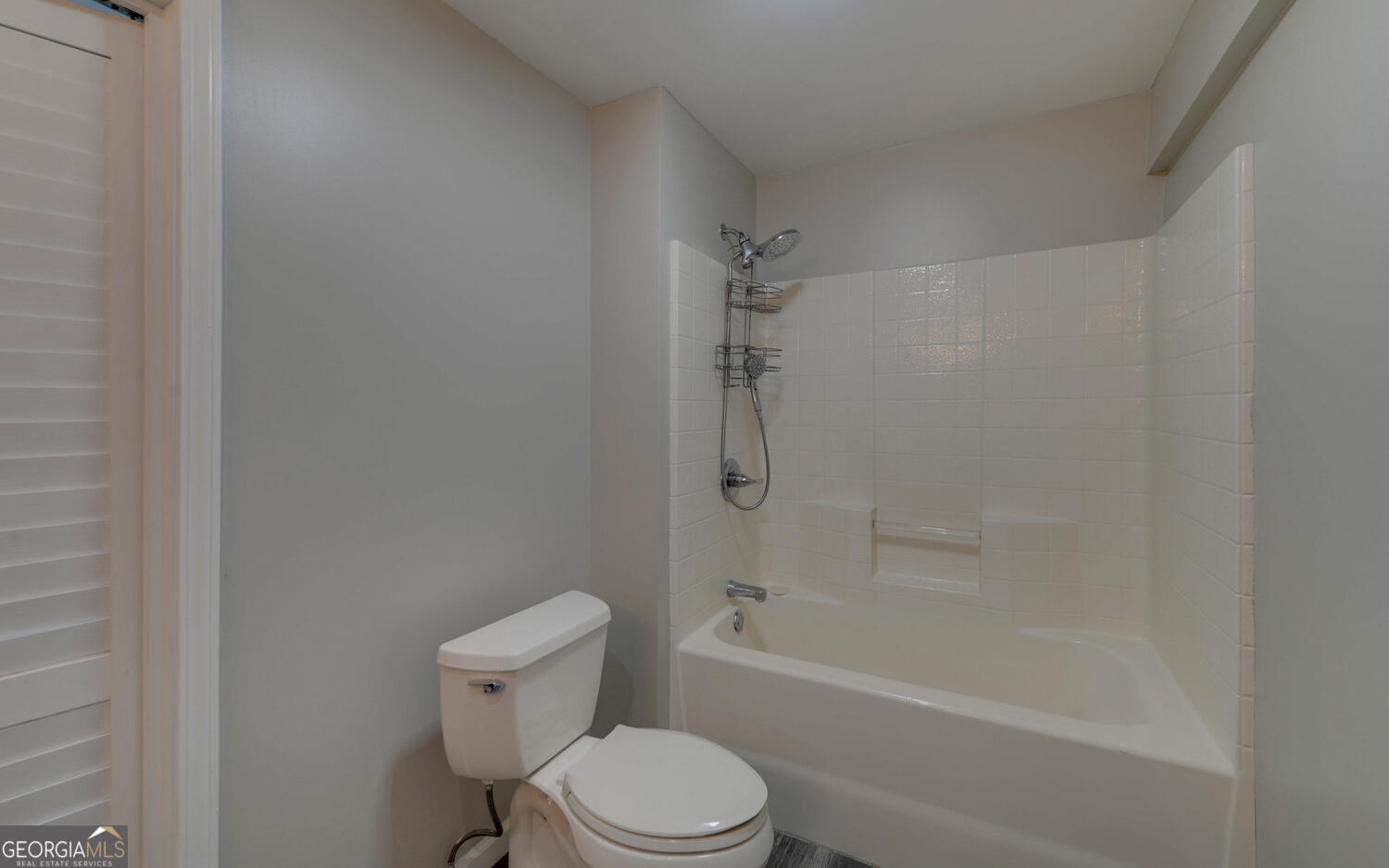 297 East Leatherwood Road Toccoa, GA 30577 - Photo 35 of 37 a white toilet and tub sitting next to a white cabinet