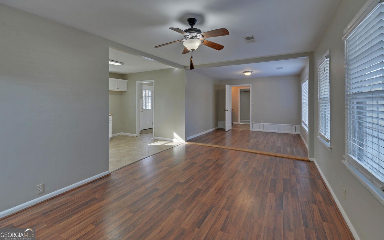297 East Leatherwood Road Toccoa, GA 30577 - Photo 9 of 37 a view of an empty room with wooden floor and a window