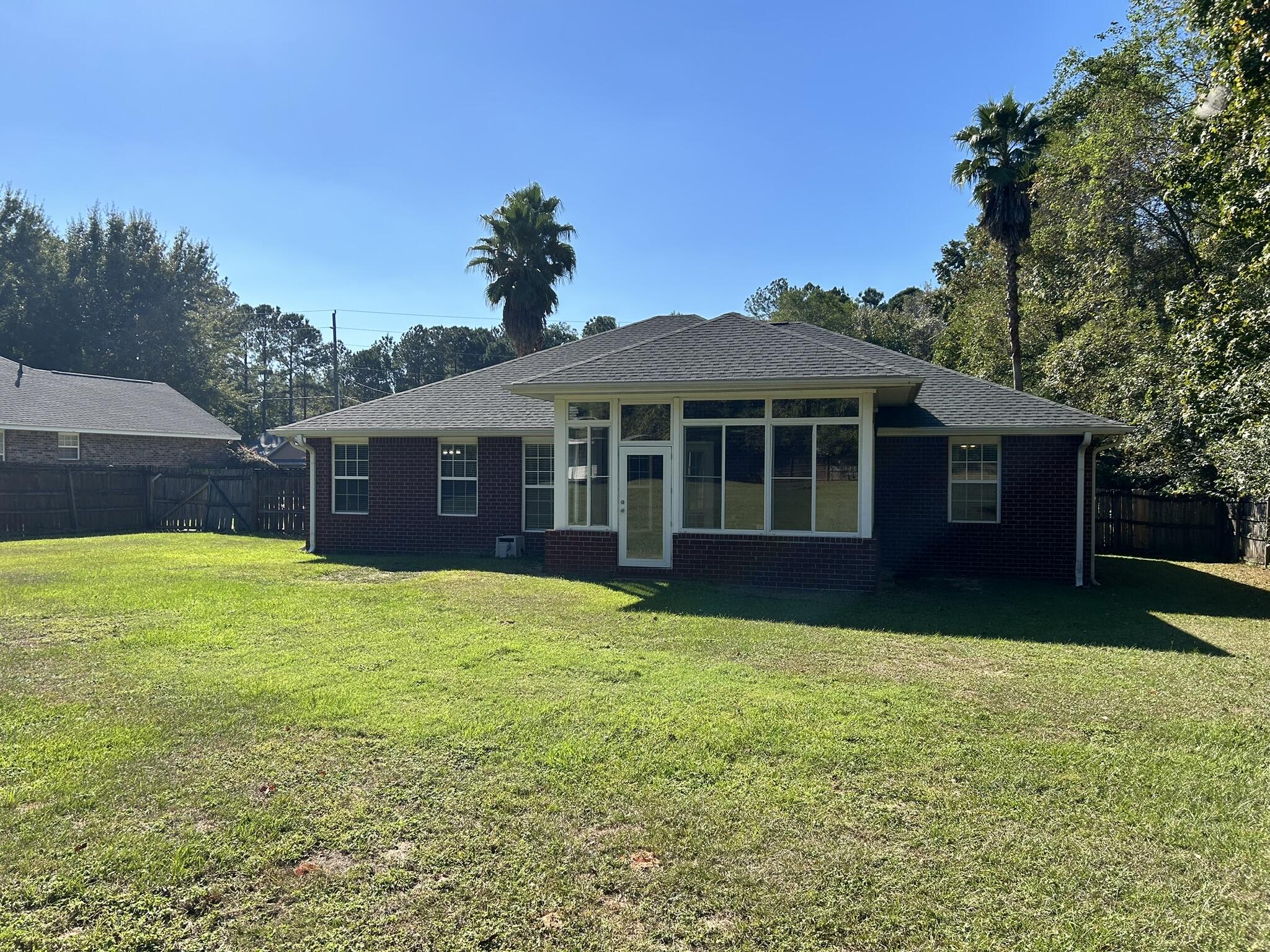5819 Roberts Road Crestview, FL 32536 - Photo 15 of 15 a view of a yard in front of a house with large tree