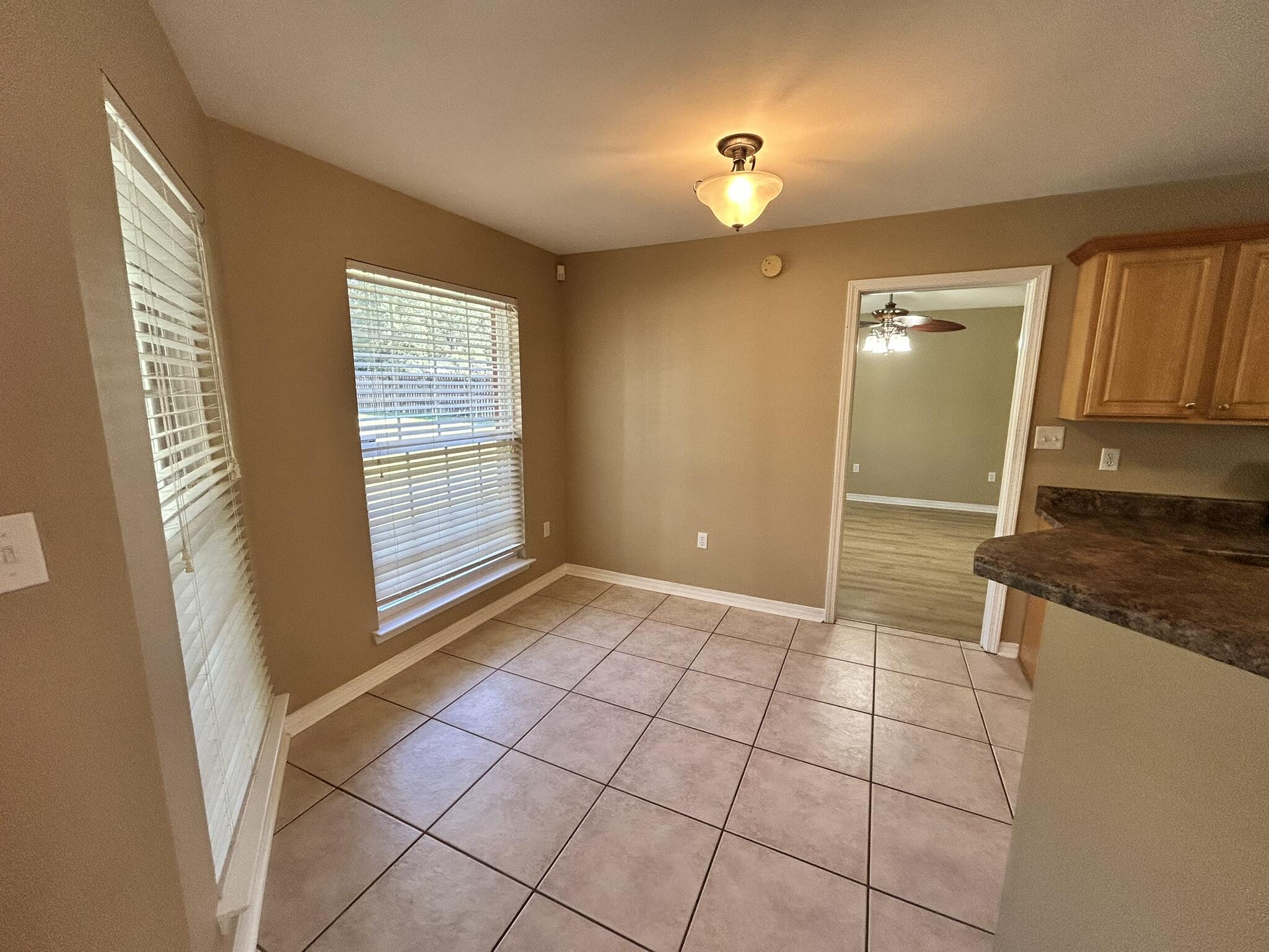 5819 Roberts Road Crestview, FL 32536 - Photo 4 of 15 a view of a kitchen with a sink and a window
