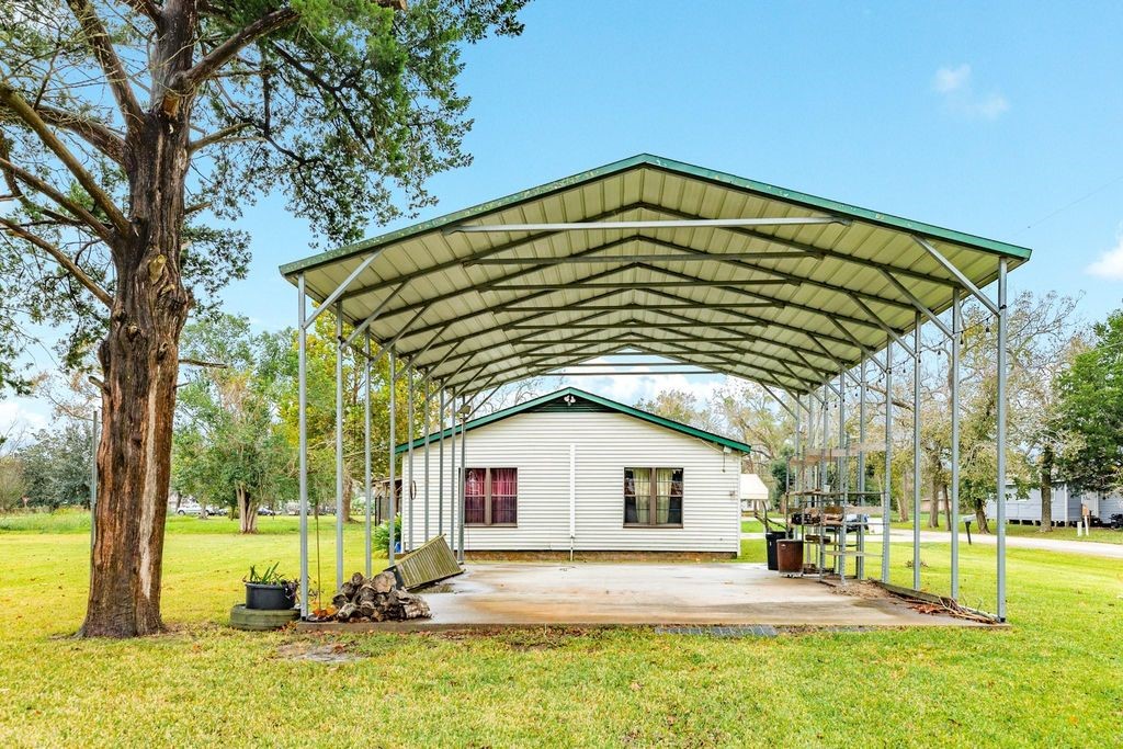 404 Chestnut Street Brazoria, TX 77422 - Photo 21 of 23 a view of a house with a yard