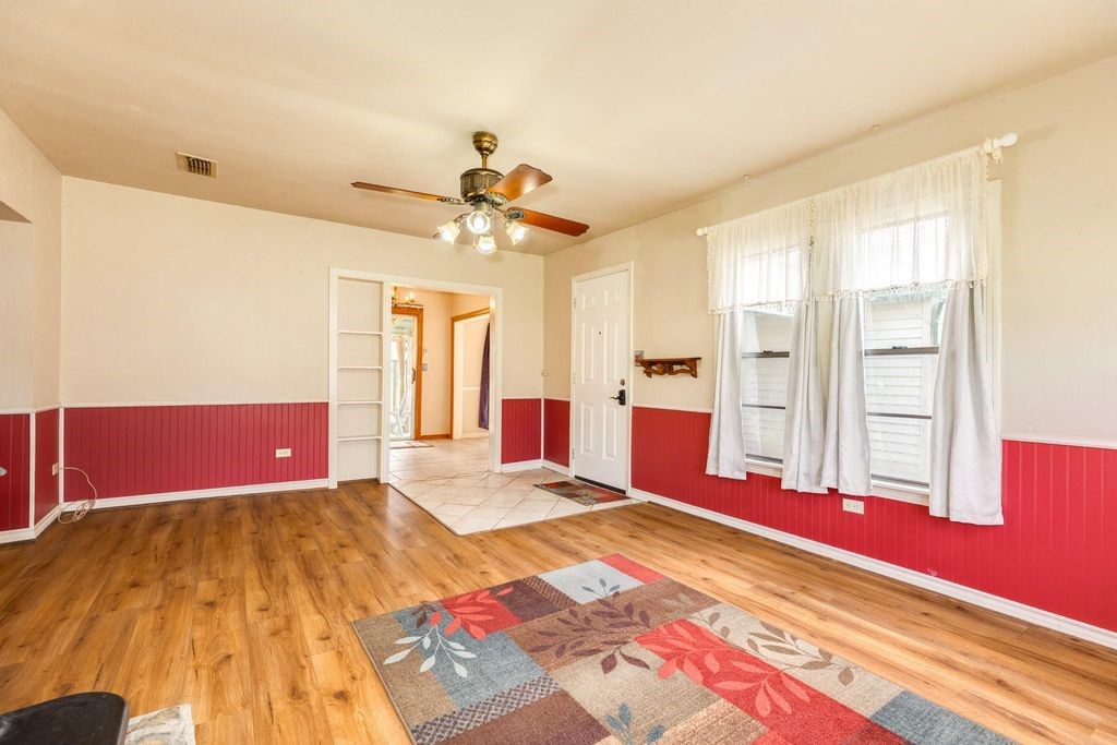 404 Chestnut Street Brazoria, TX 77422 - Photo 6 of 23 a bedroom with a bed dresser and a window