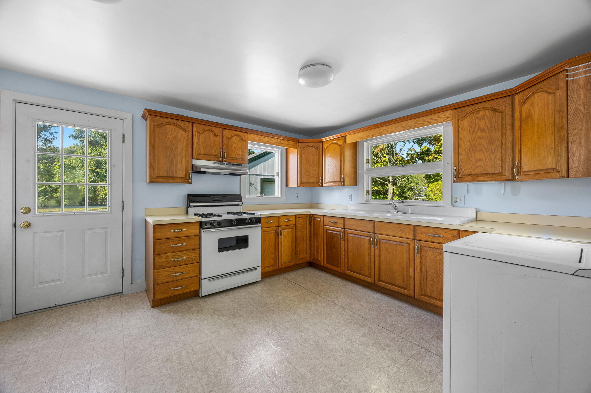 9 Harrison Avenue Buzzards Bay, MA 02532 - Photo 11 of 47 a kitchen with stainless steel appliances a stove a sink and a microwave