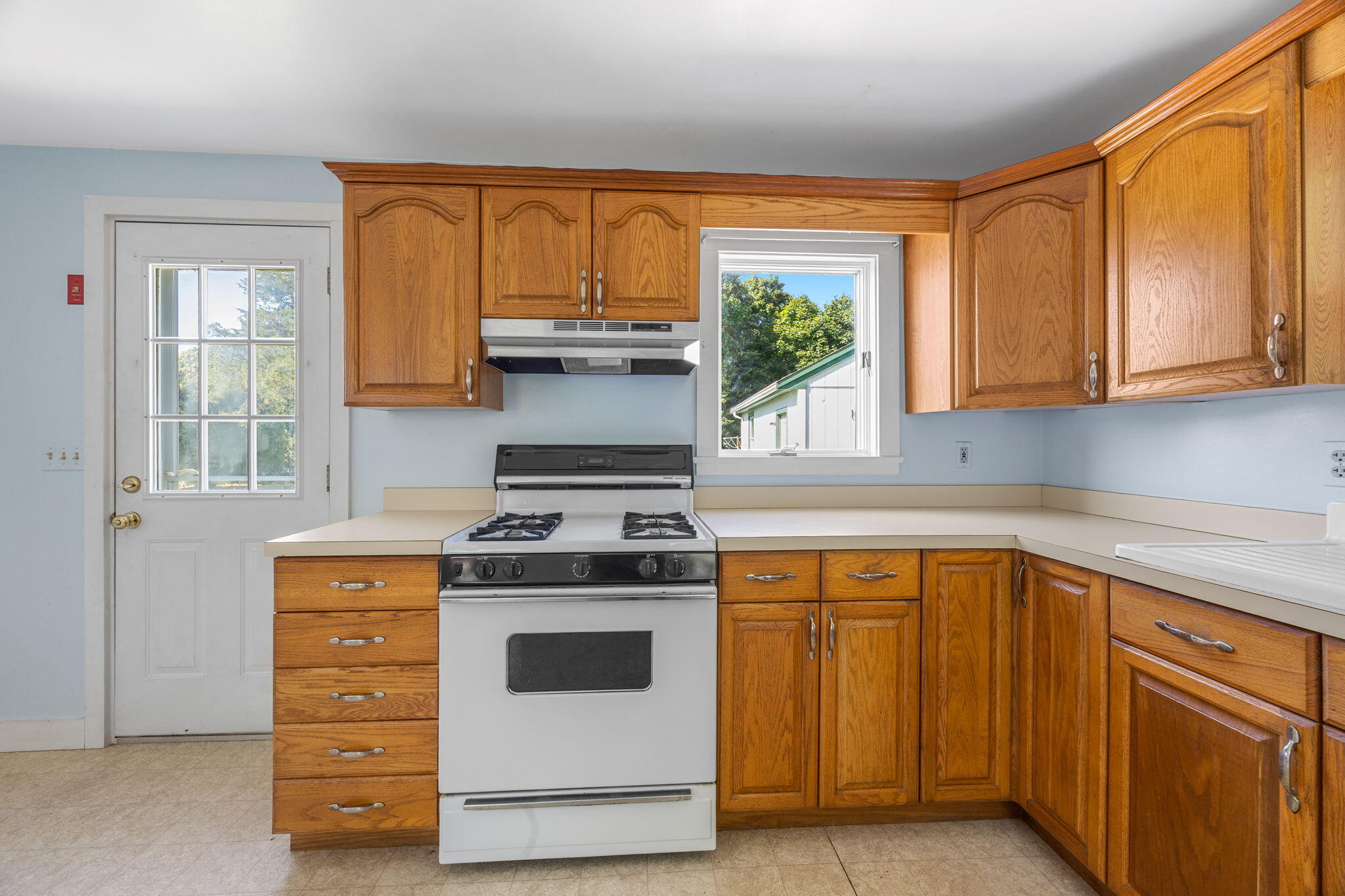 9 Harrison Avenue Buzzards Bay, MA 02532 - Photo 12 of 47 a kitchen with appliances cabinets and a sink