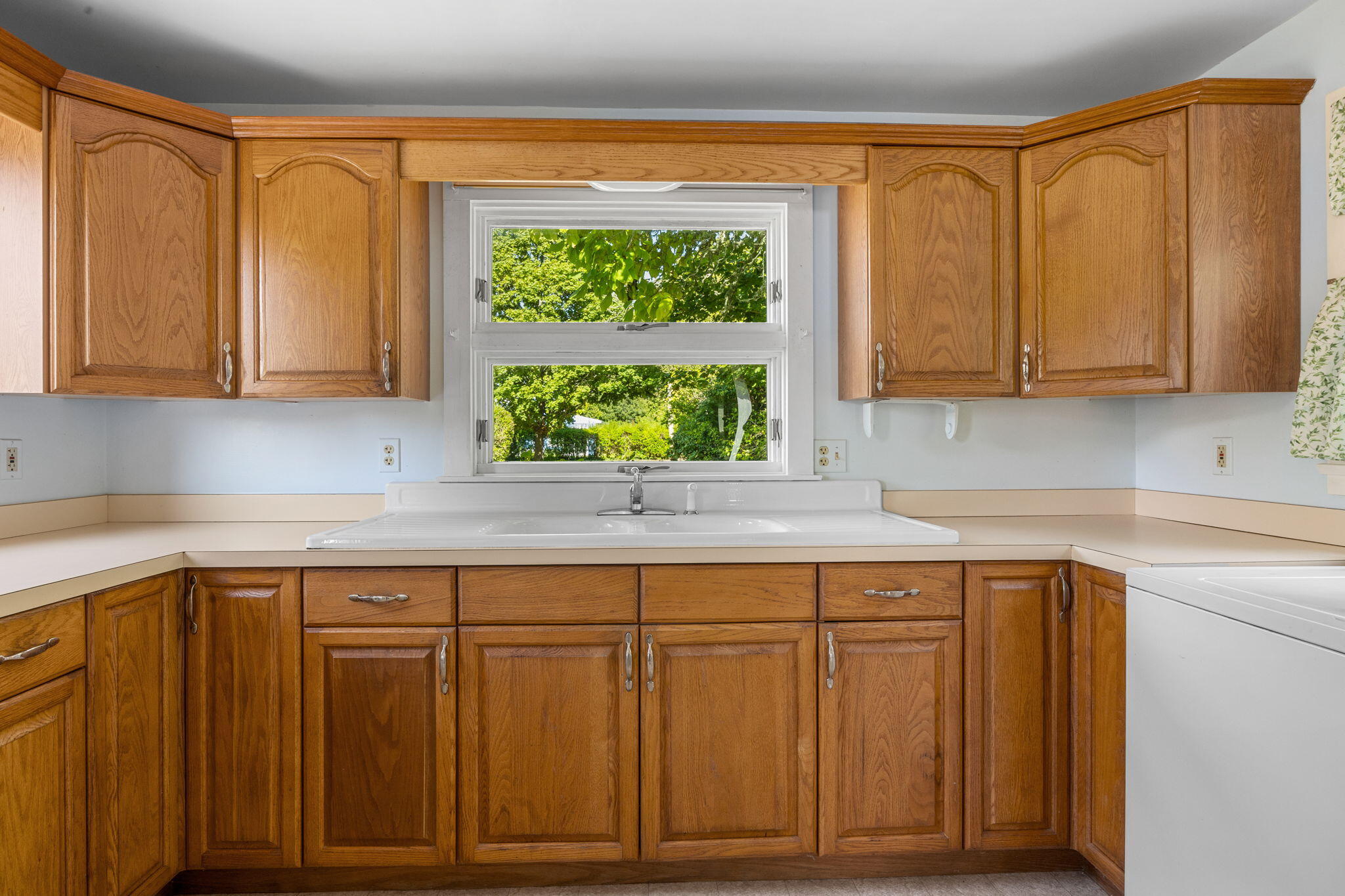 9 Harrison Avenue Buzzards Bay, MA 02532 - Photo 14 of 47 a kitchen with wooden cabinets and a sink